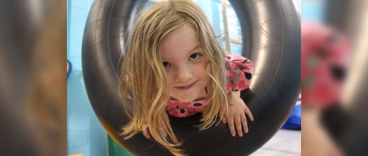 Girl Playing with Tube